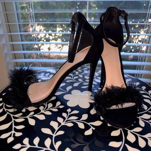 Black heels with feather detailed toe strap